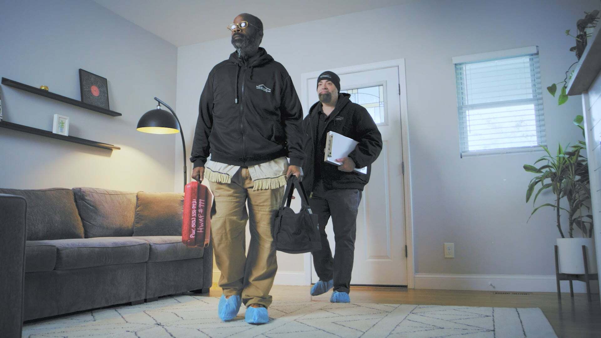 Two PWC Employees Enter a House