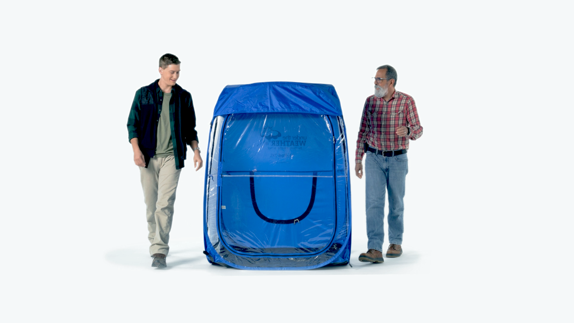 Two men stand beside a blue weatherpod