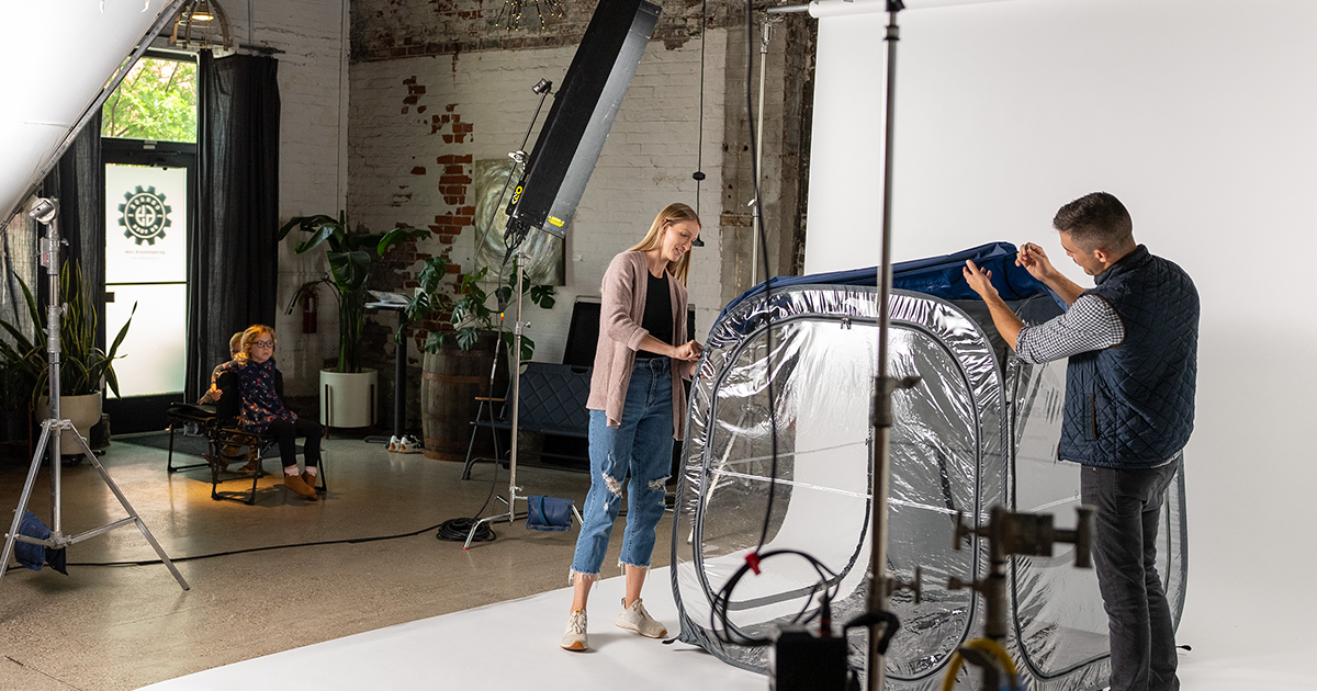 Behind-the-scenes photo of a WeatherPod being set up on a white studio background.
